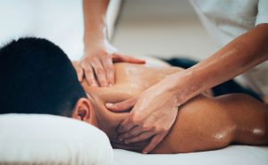 How does a full body massage help in reducing stress and muscle pain